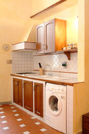 Florence Centre Accommodation: Kitchen with washing machine of Tafi Accommodation in Florence centre